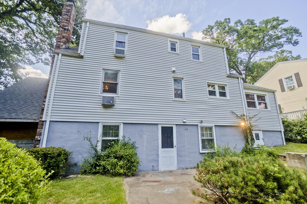 21 Bremen Street Springfield, MA 01108 - Photo 3 of 40 a front view of a house with plants and entryway