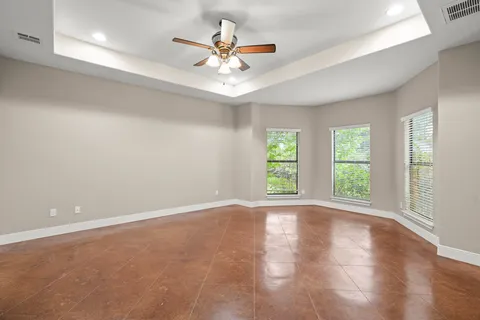 a kitchen with stainless steel appliances granite countertop a refrigerator a sink dishwasher and a stove with wooden floor