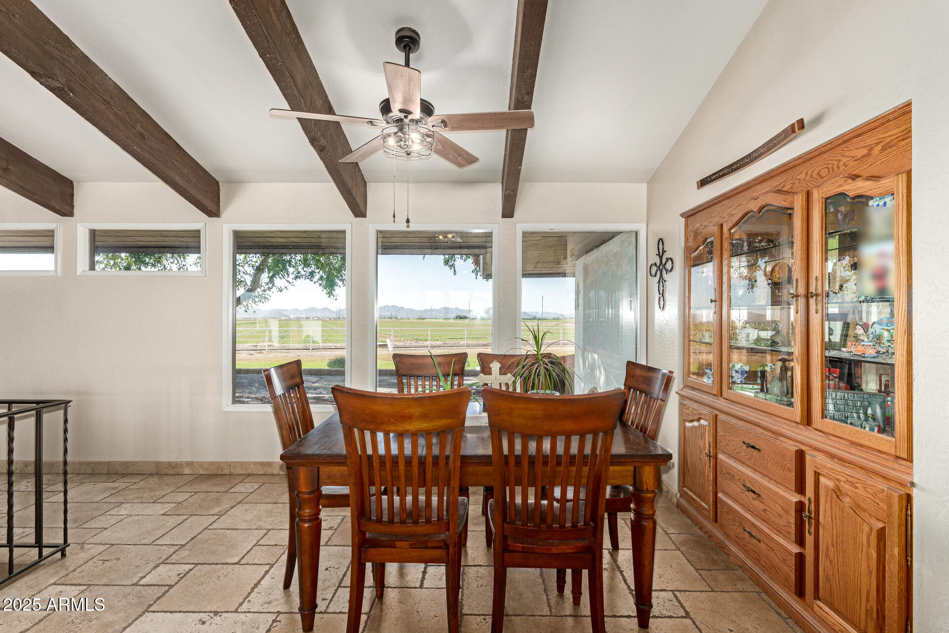 6901 South Palo Verde Road Buckeye, AZ 85326 - Photo 15 of 43 a view of a dining room with furniture wooden floor and chandelier