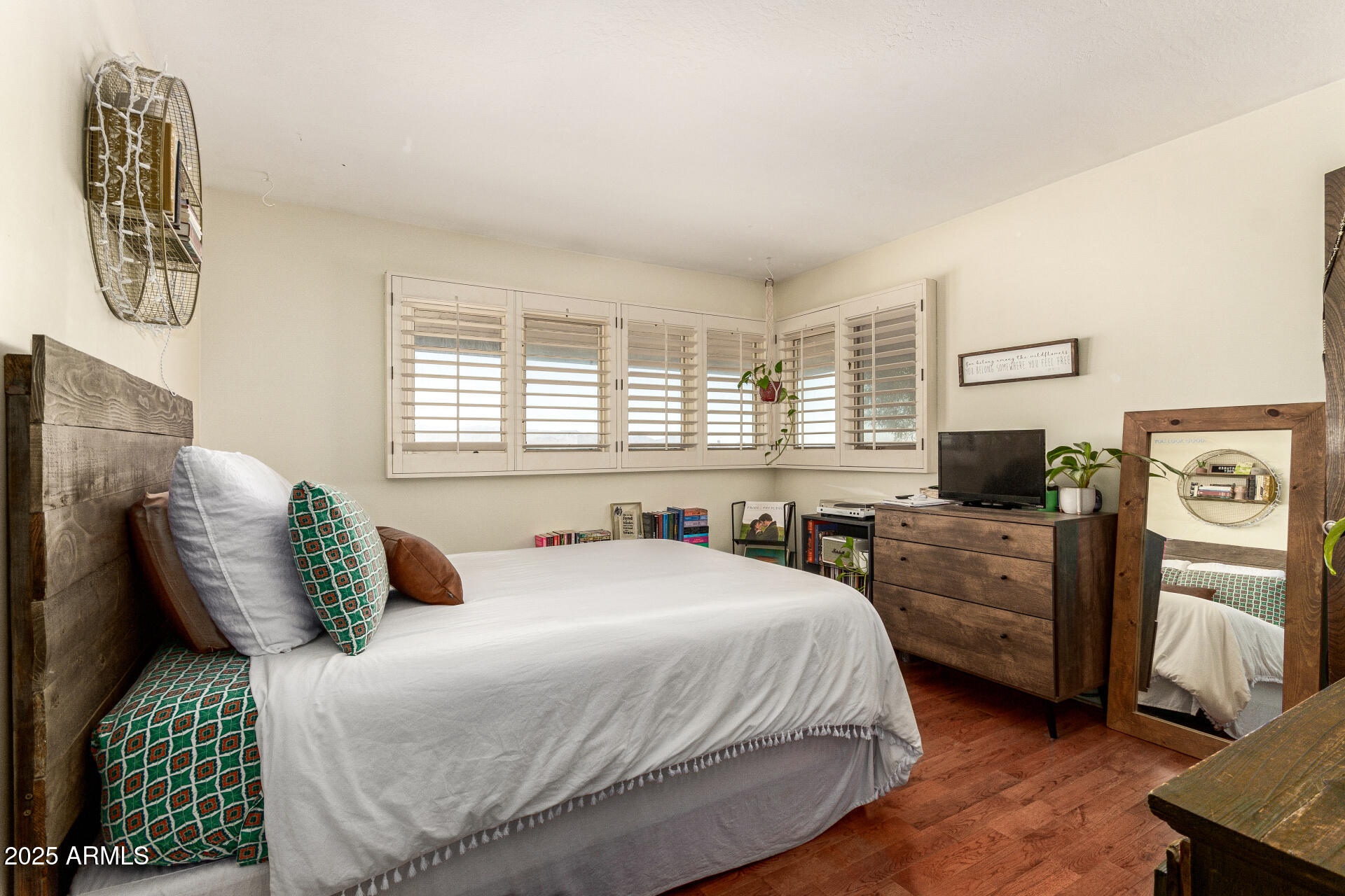 6901 South Palo Verde Road Buckeye, AZ 85326 - Photo 21 of 43 a bedroom with a large bed and a couch