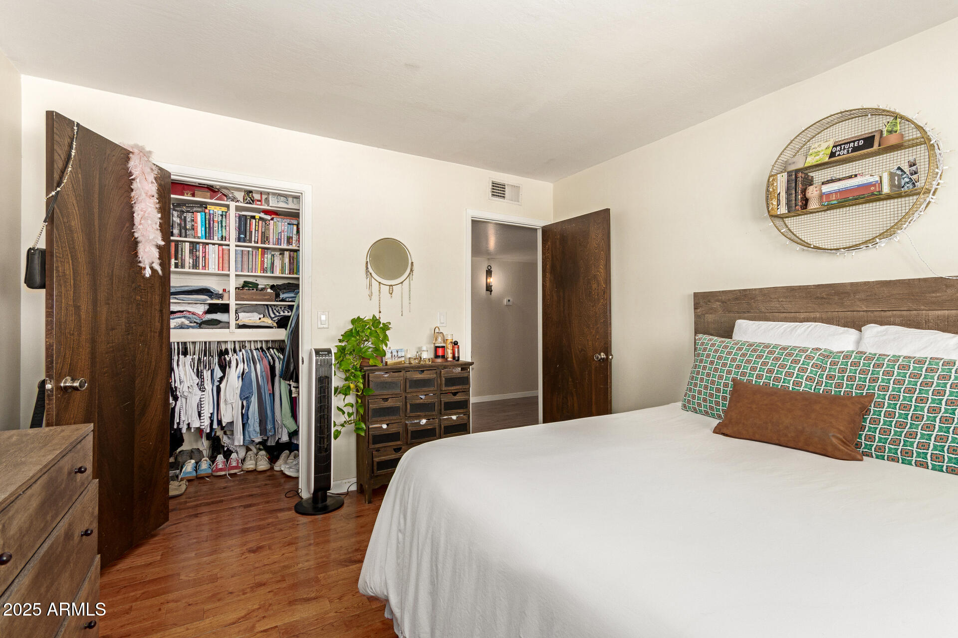 6901 South Palo Verde Road Buckeye, AZ 85326 - Photo 22 of 43 a bedroom with a bed and a flat tv screen on dresser