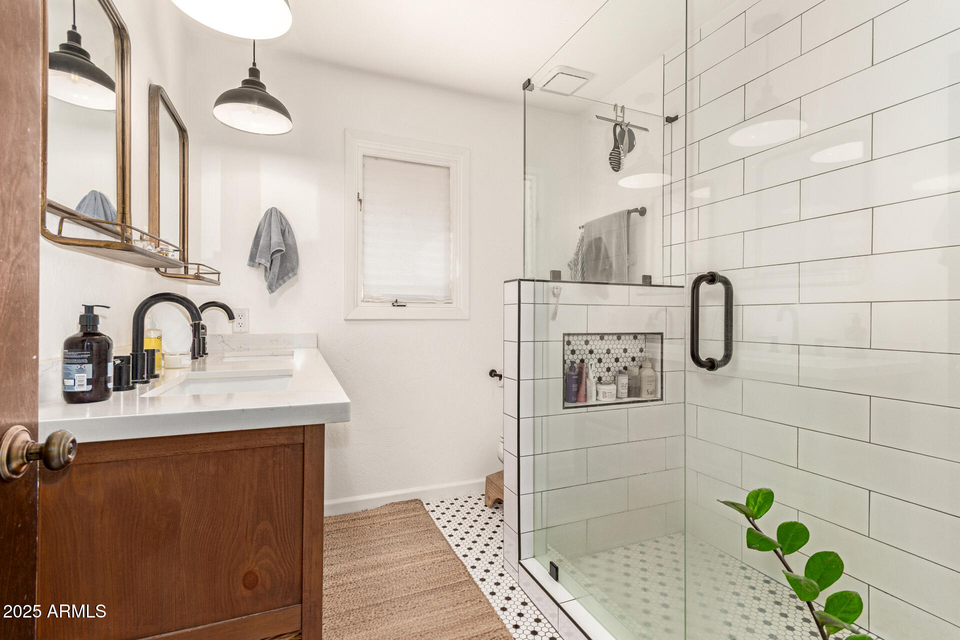 6901 South Palo Verde Road Buckeye, AZ 85326 - Photo 25 of 43 a bathroom with a sink shower and a mirror