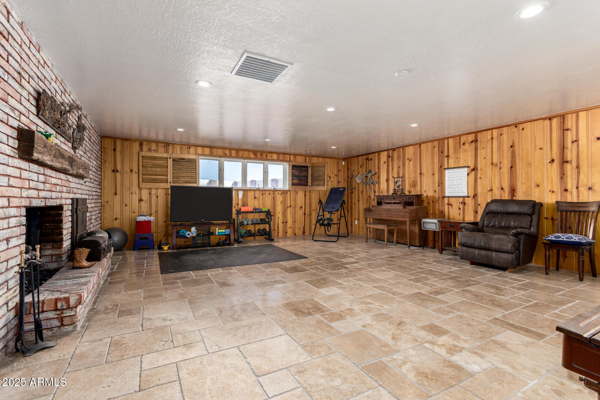 6901 South Palo Verde Road Buckeye, AZ 85326 - Photo 27 of 43 a view of a livingroom with furniture and a flat screen tv