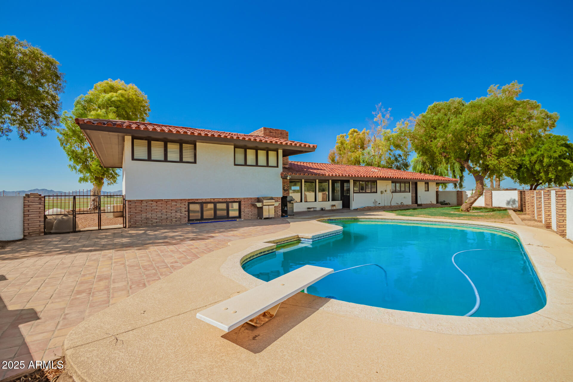 6901 South Palo Verde Road Buckeye, AZ 85326 - Photo 36 of 43 a view of a swimming pool with a patio