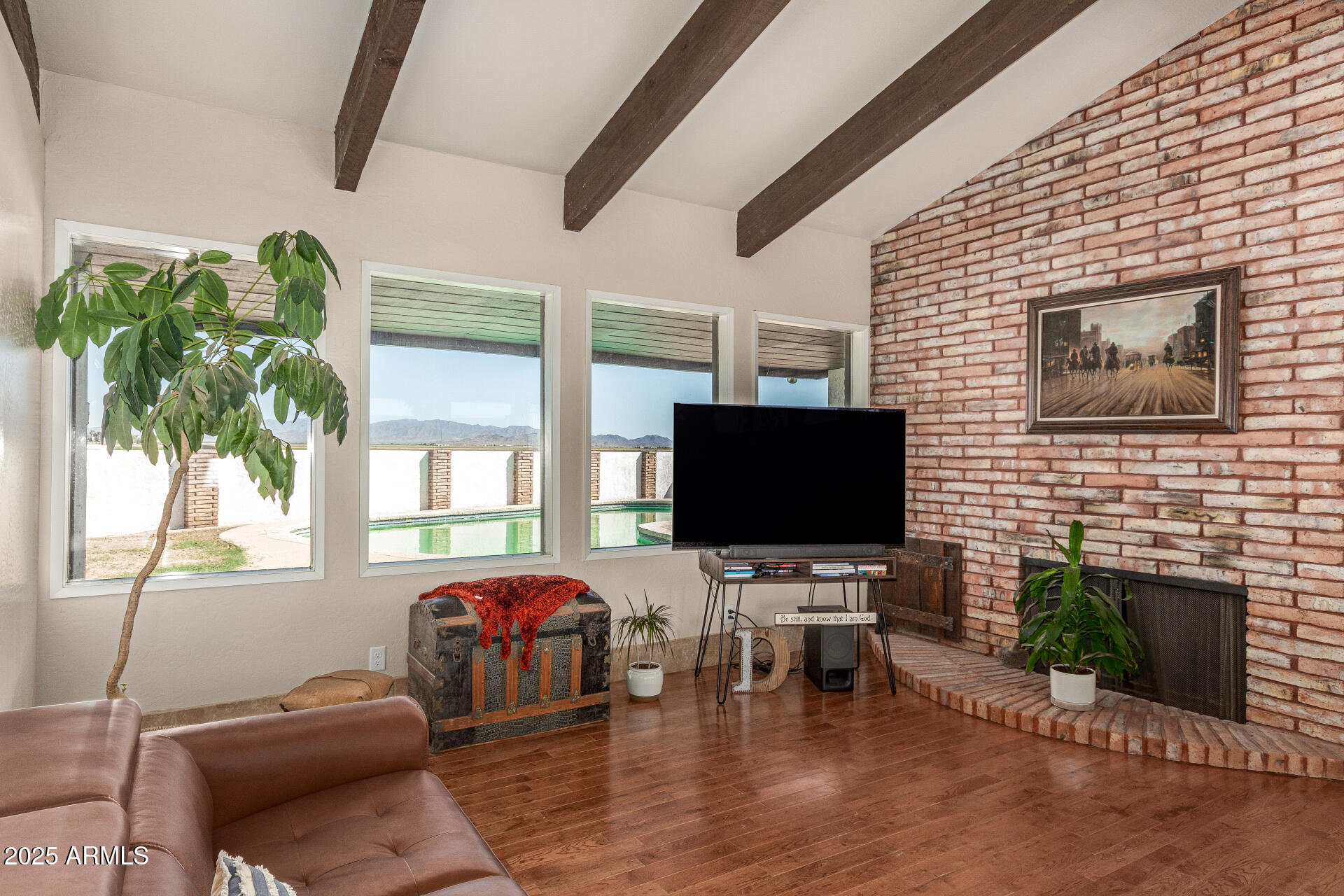 6901 South Palo Verde Road Buckeye, AZ 85326 - Photo 10 of 43 a living room with fireplace furniture and a flat screen tv