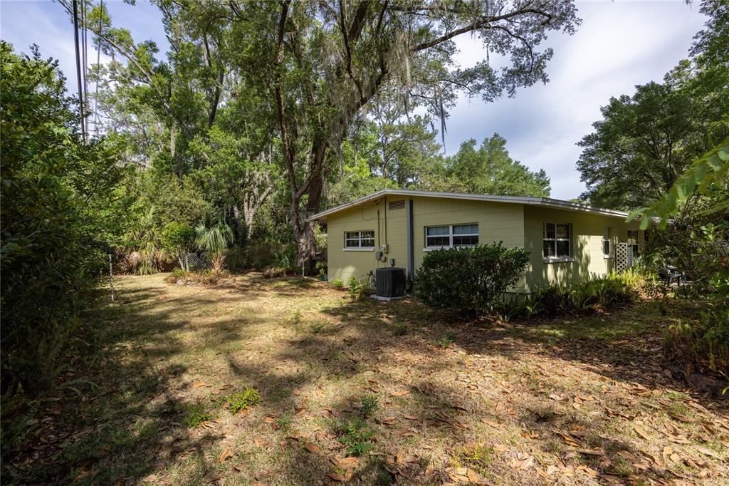 4123 Northwest 18th Place Gainesville, FL 32605 - Photo 26 of 36 a view of a house with yard and tree s