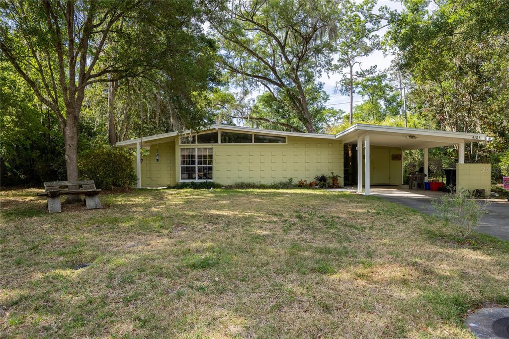 4123 Northwest 18th Place Gainesville, FL 32605 - Photo 27 of 36 a view of a house with backyard