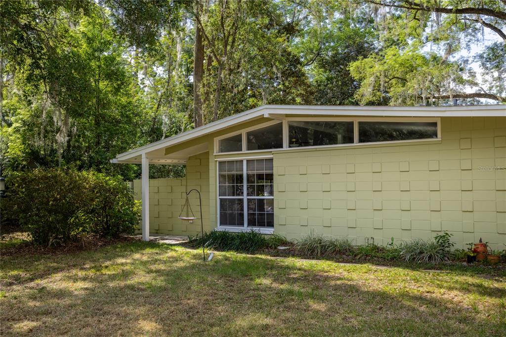 4123 Northwest 18th Place Gainesville, FL 32605 - Photo 29 of 36 a front view of a house with a yard