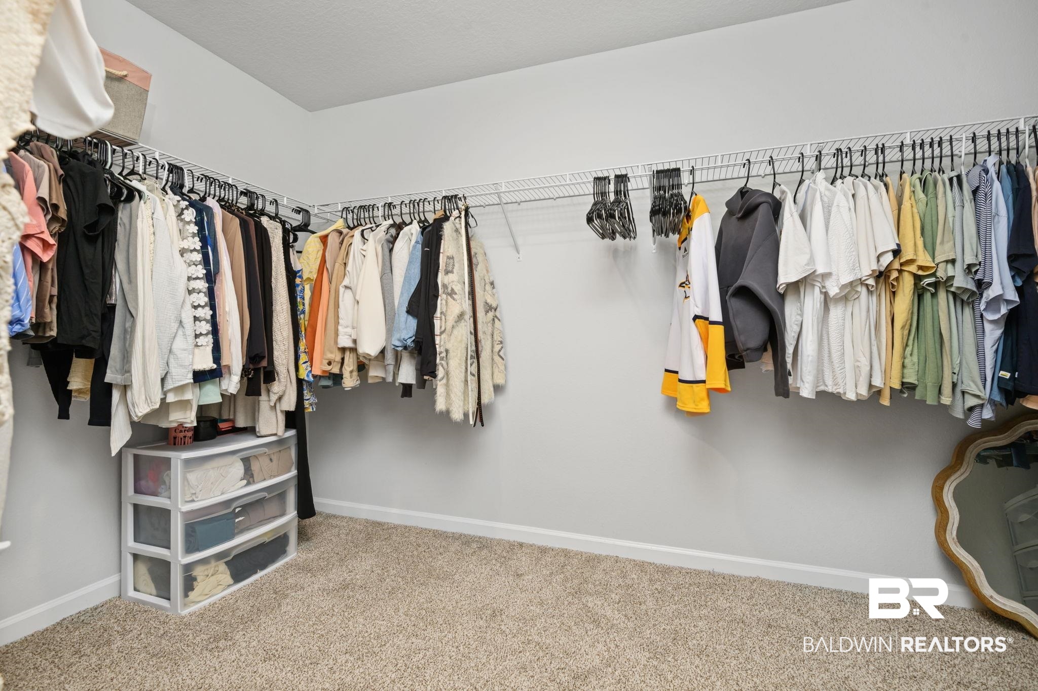 8021 Valor Rdg Way North Mobile, AL 36619 - Photo 32 of 34 Carpeted closet space featuring white walls and wrap-around wire shelving for storage