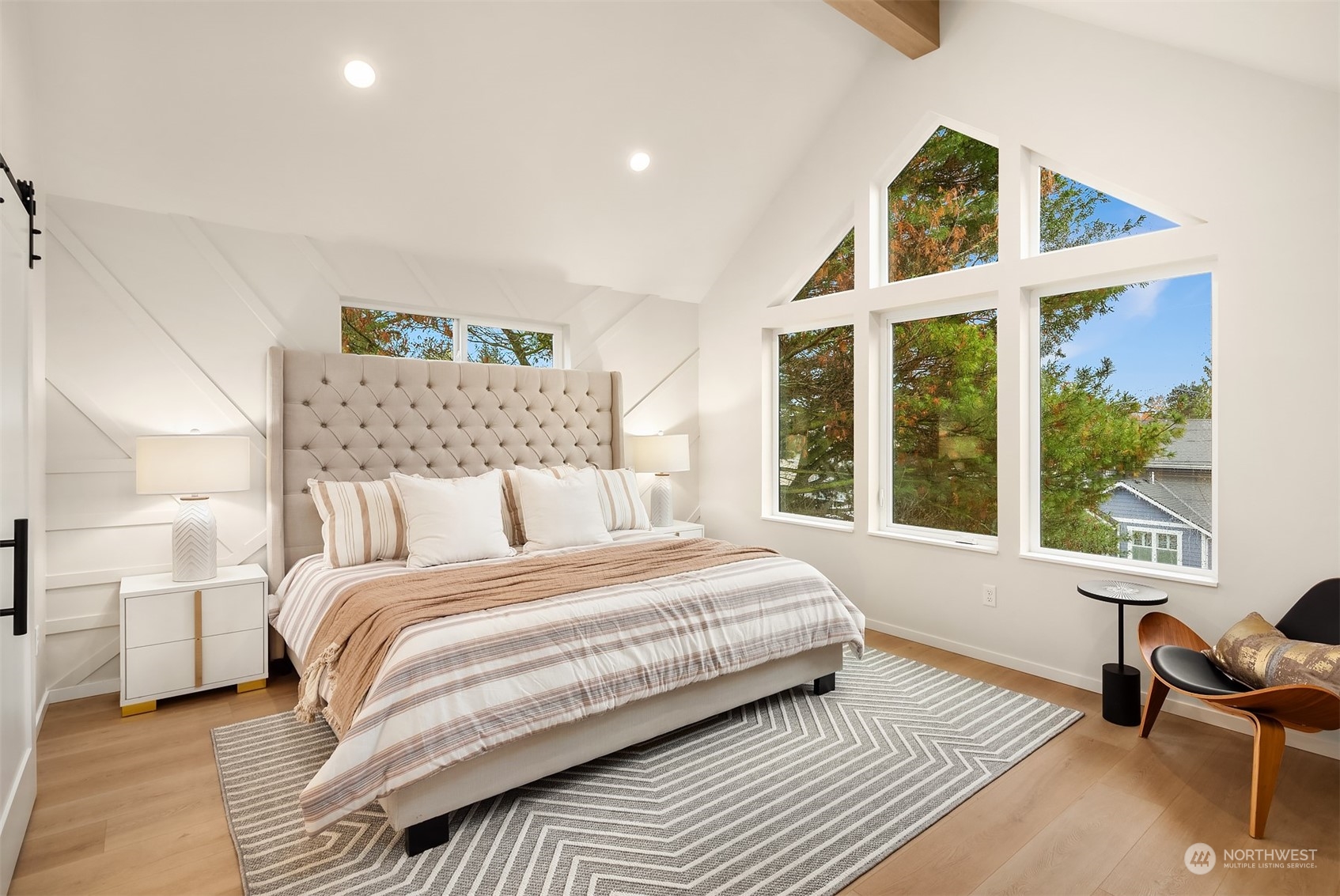 3234 Northeast 88th Street Seattle, WA 98115 - Photo 15 of 23 a bedroom with a bed and a large window