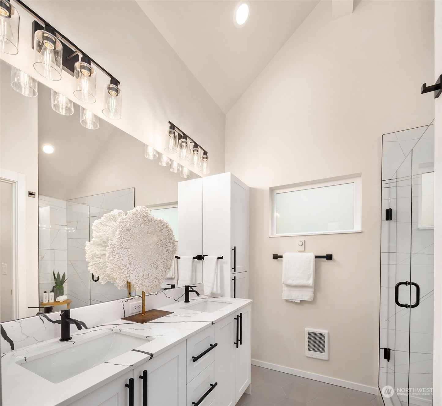 3234 Northeast 88th Street Seattle, WA 98115 - Photo 16 of 23 a bathroom with a double vanity sink mirror and double
