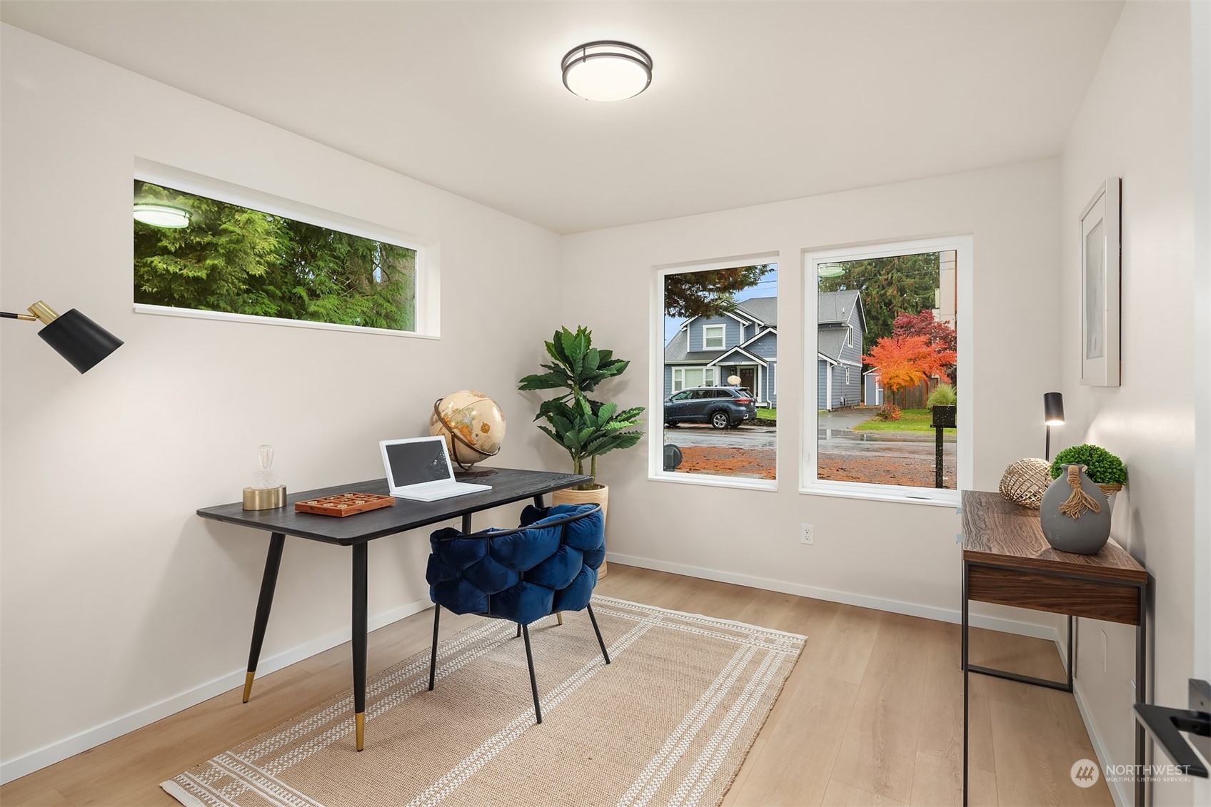 3234 Northeast 88th Street Seattle, WA 98115 - Photo 4 of 23 a workspace with furniture and a window
