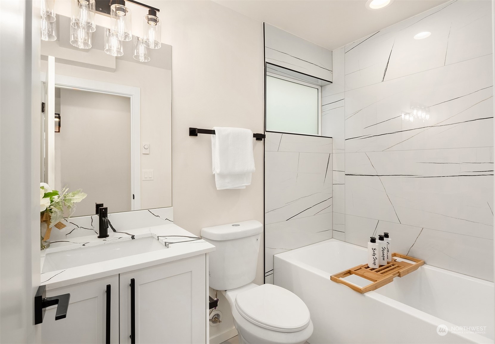 3234 Northeast 88th Street Seattle, WA 98115 - Photo 6 of 23 a bathroom with a sink a toilet and shower