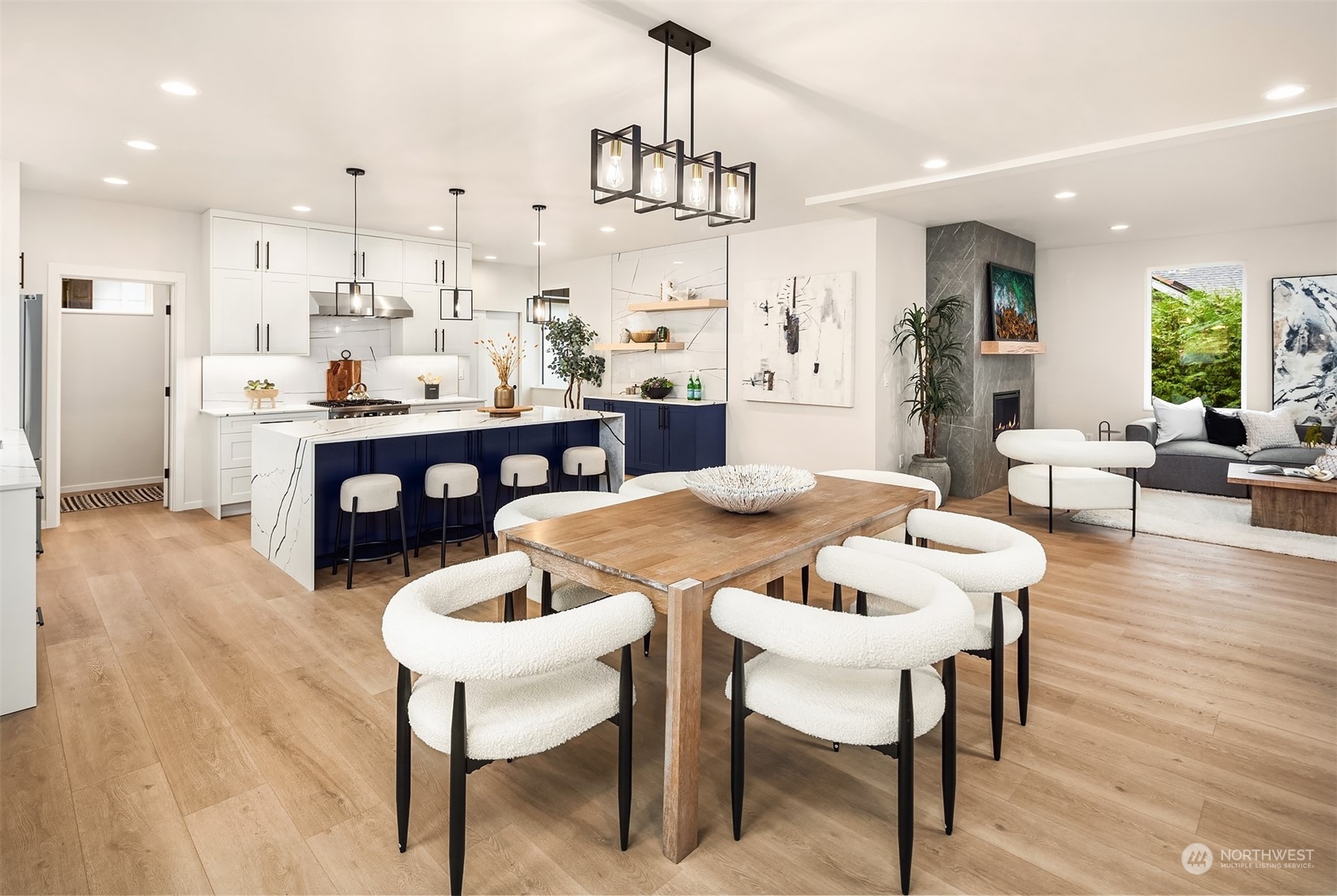 3234 Northeast 88th Street Seattle, WA 98115 - Photo 7 of 23 a view of a dining room and livingroom with furniture wooden floor a chandelier