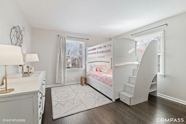 a bedroom with a bed and a desk in it