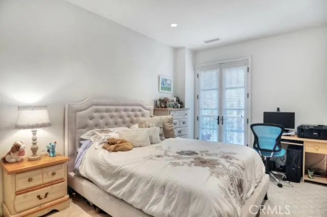 a bedroom with a bed and a cabinets