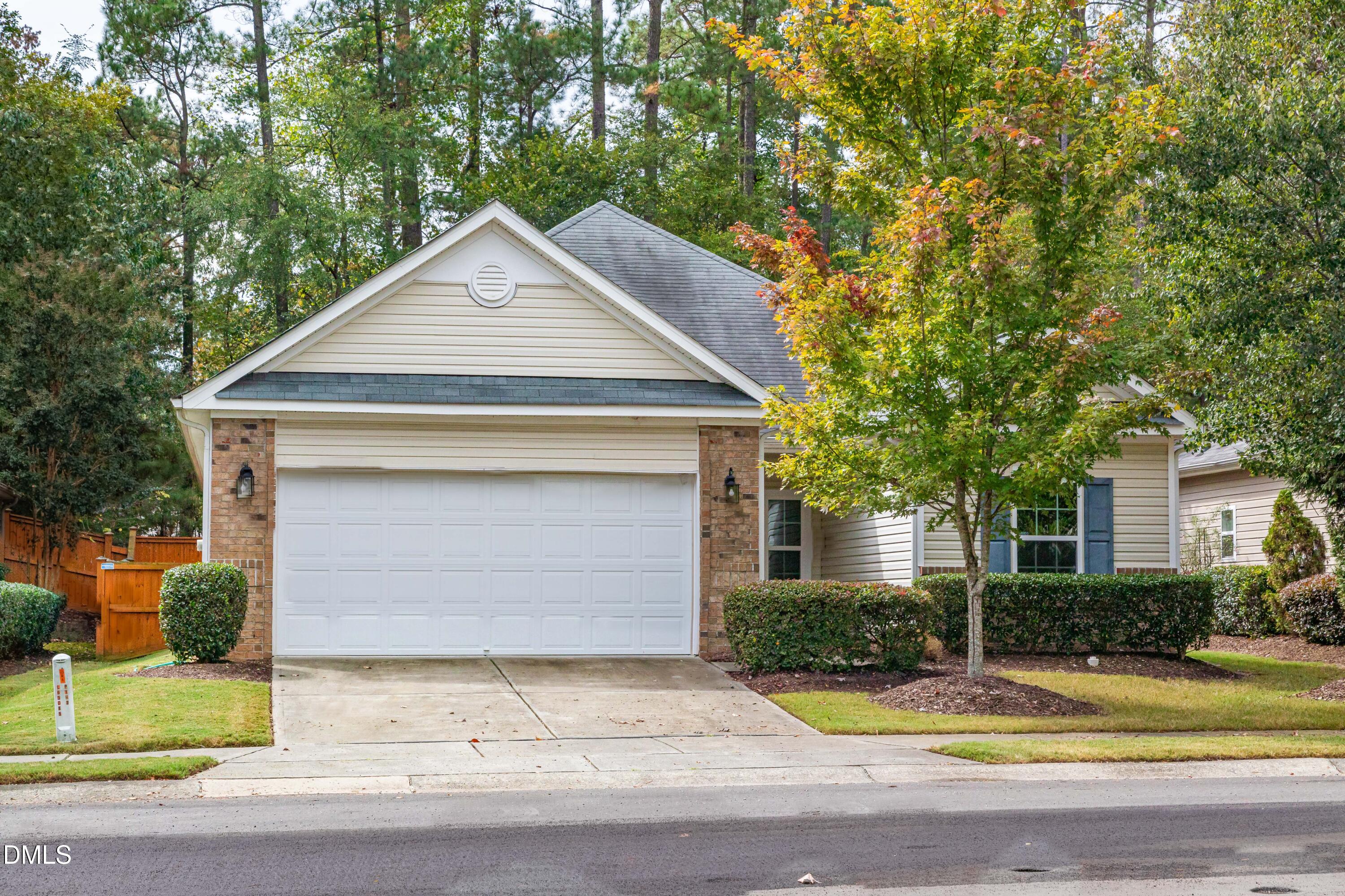 33 Juliette Drive Durham, NC 27713 - Photo 1 of 39 a front view of a house with a yard and garage
