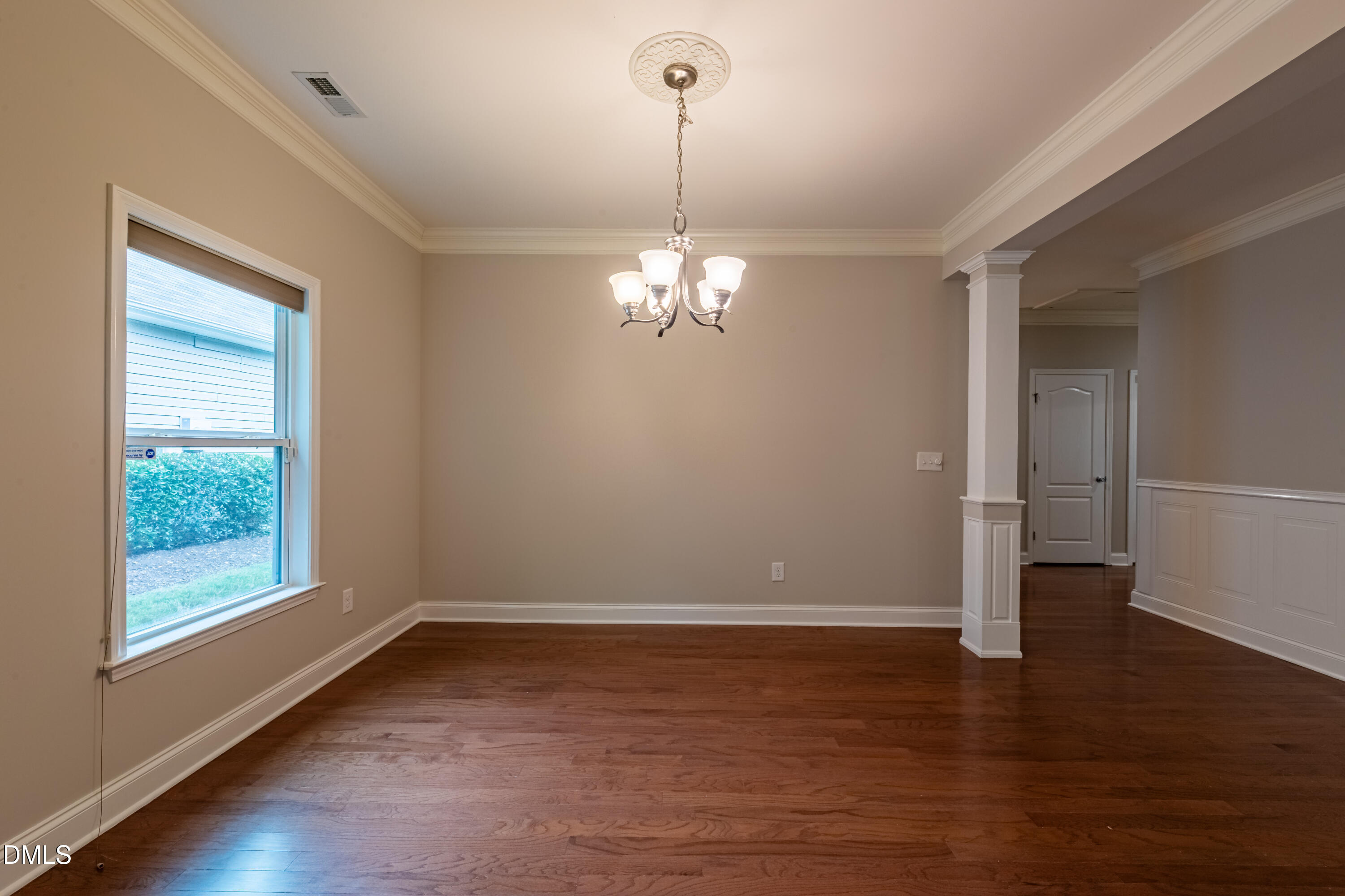 33 Juliette Drive Durham, NC 27713 - Photo 10 of 39 a view of a room with wooden floor chandelier and window