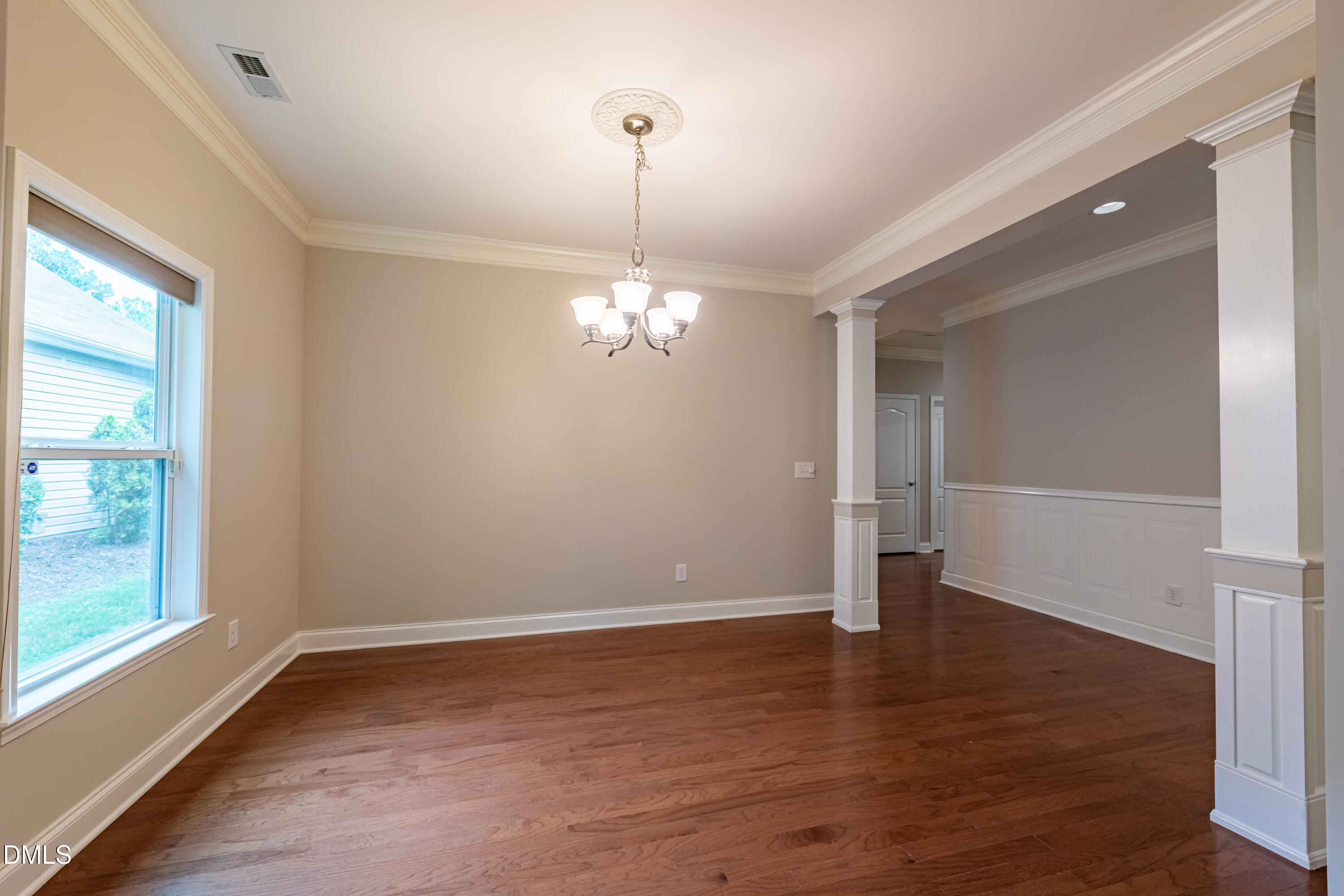 33 Juliette Drive Durham, NC 27713 - Photo 11 of 39 a view of a room with wooden floor chandelier and windows