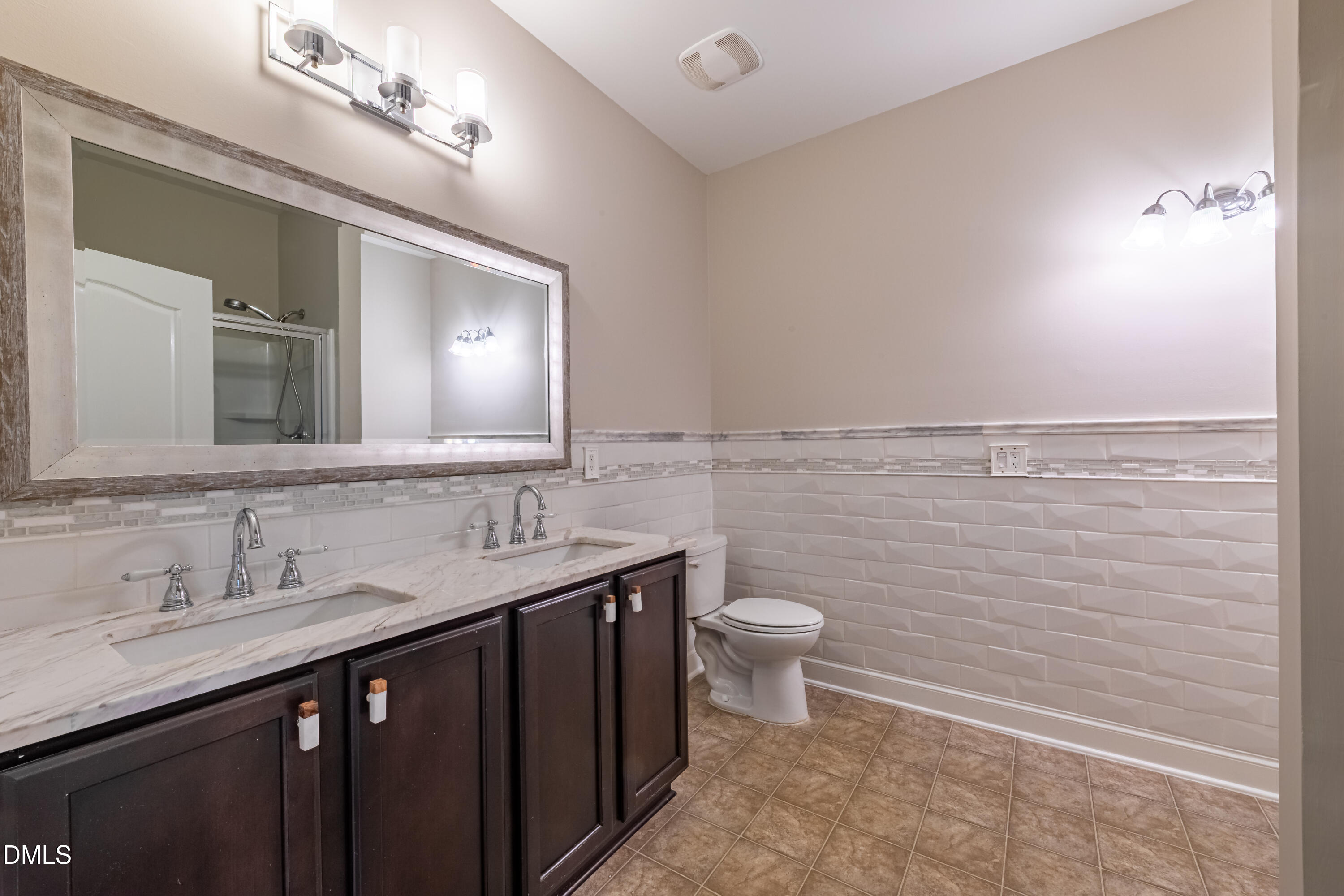33 Juliette Drive Durham, NC 27713 - Photo 26 of 39 a bathroom with a toilet sink and mirror