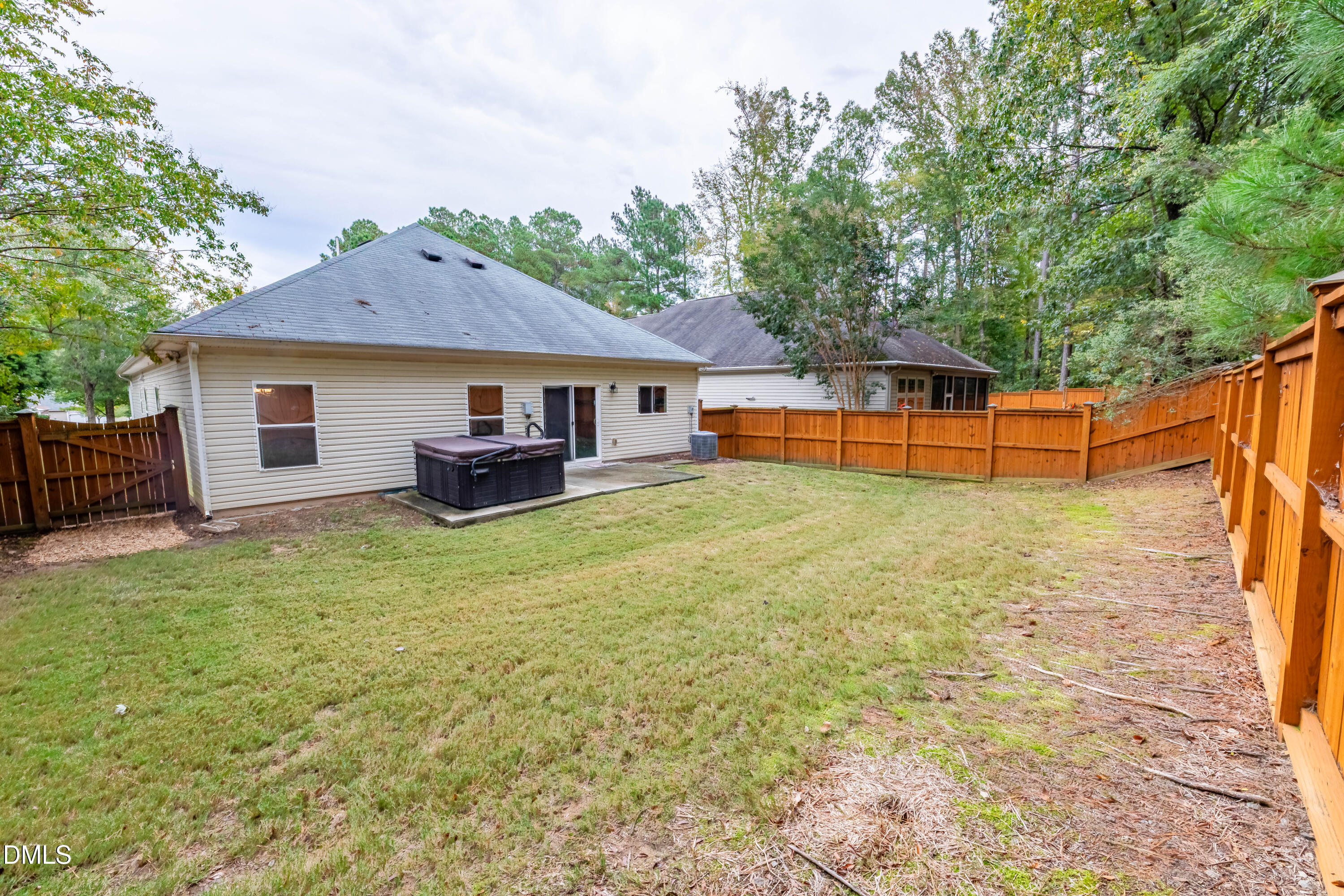 33 Juliette Drive Durham, NC 27713 - Photo 33 of 39 a backyard of a house with table and chairs