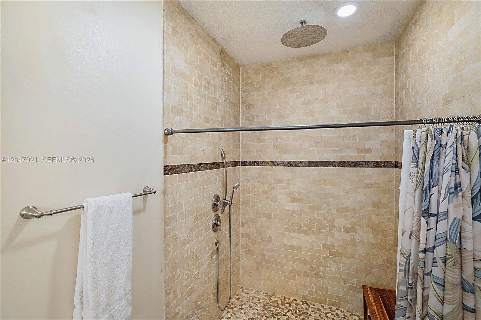12127 154th Road North Jupiter, FL 33478 - Photo 34 of 67 Roll in Shower and Rainfall Shower feature