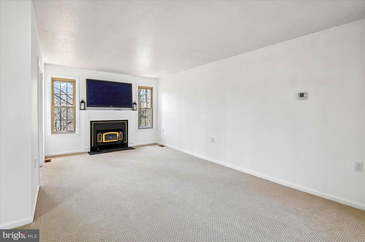 860 Woodmont Road Annapolis, MD 21401 - Photo 11 of 55 Living Room with new carpet