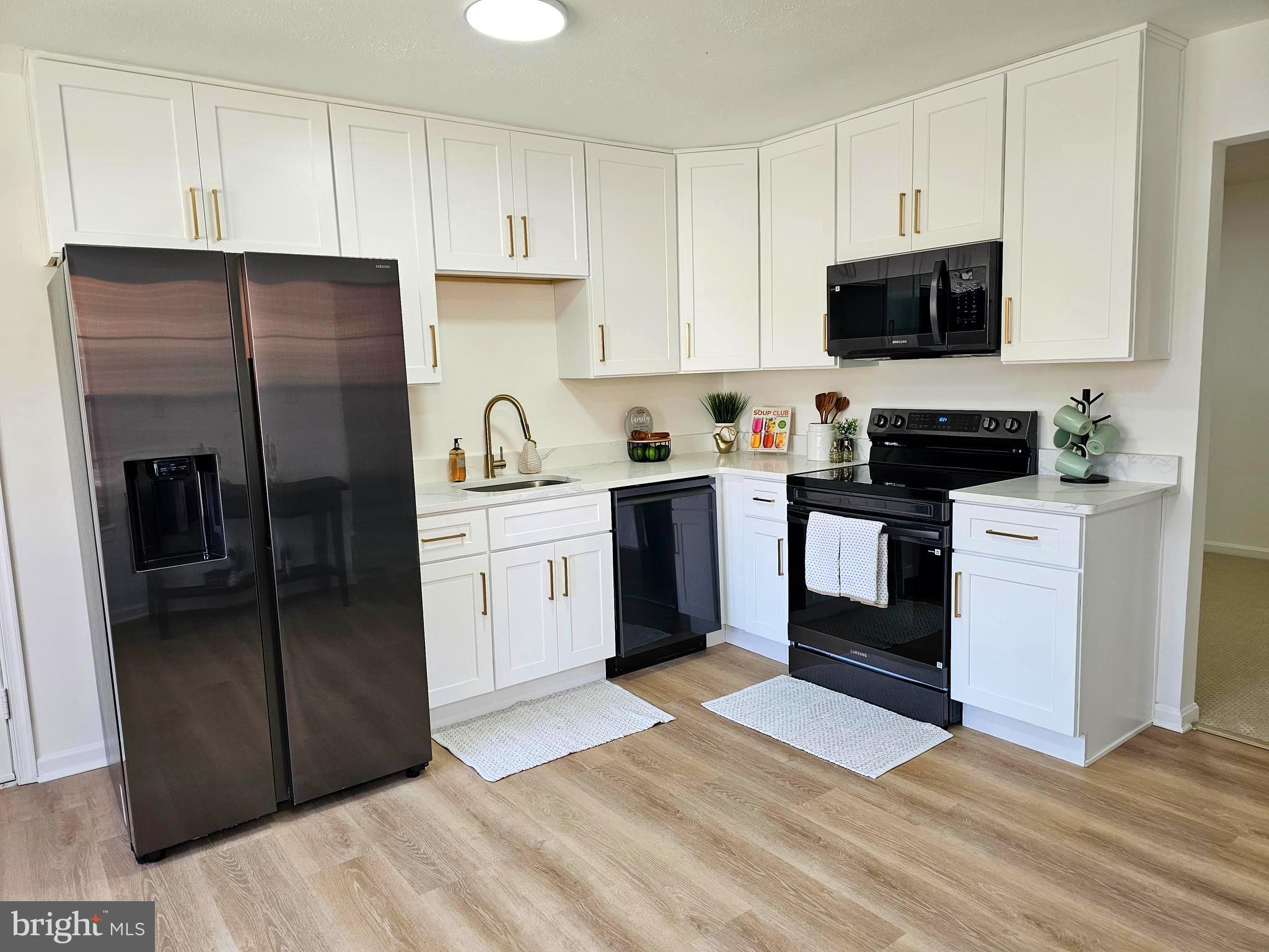860 Woodmont Road Annapolis, MD 21401 - Photo 7 of 55 Bright White Cabinets and Quartz Counters