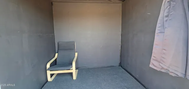 a view of chair and table in a room