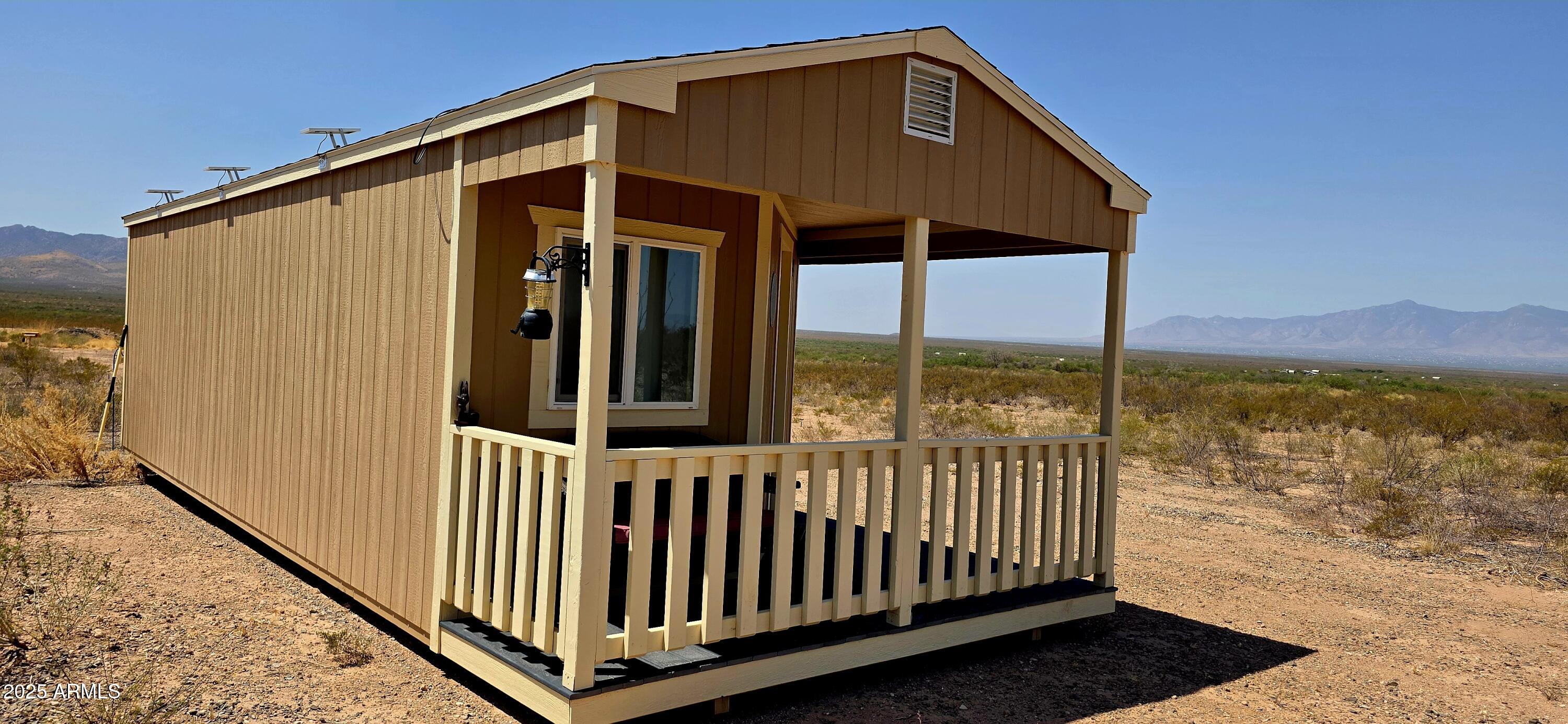 Lot 4 South Macks Way, Unit 4 Tombstone, AZ 85638 - Photo 4 of 22 a front view of a house with ocean view