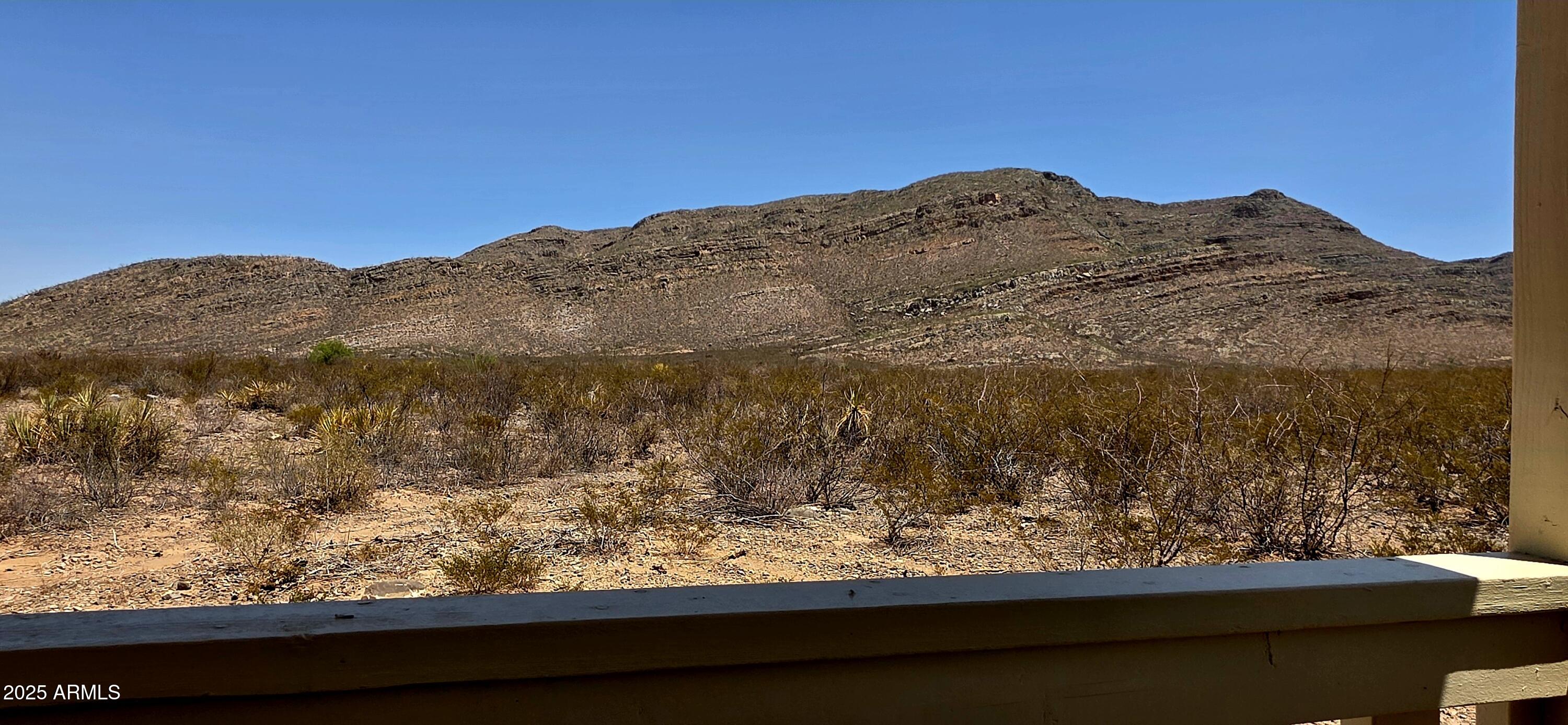 Lot 4 South Macks Way, Unit 4 Tombstone, AZ 85638 - Photo 5 of 22 a view of a yard with a mountain