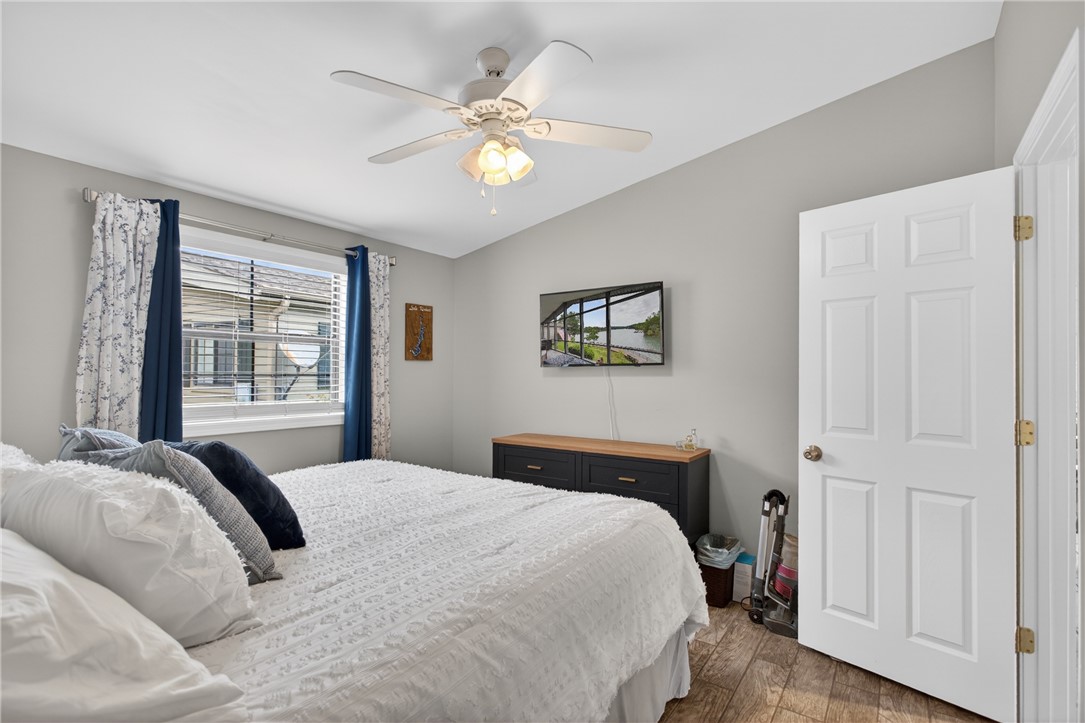 1230 Melton Road, Unit 4 West Union, SC 29696 - Photo 22 of 48 A restful bedroom offers comfort with a practical ceiling fan and durable flooring.