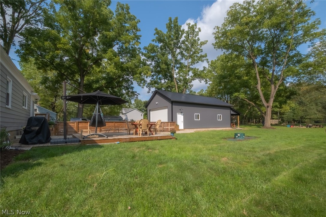 911 Schocalog Road Akron, OH 44320 - Photo 25 of 31 Deck and barn in back yard fenced in area