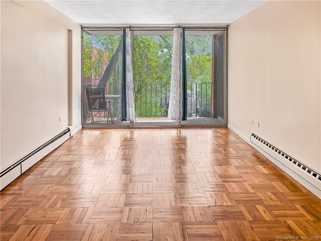 87 Glenbrook Road, Unit 3E Stamford, CT 06902 - Photo 5 of 11 a view of an empty room with a window