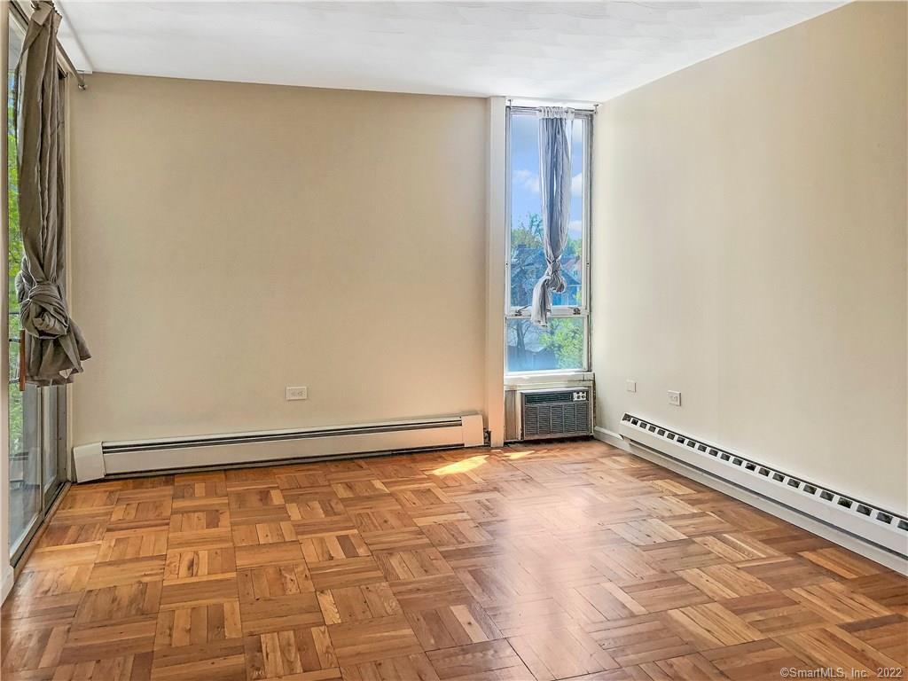 87 Glenbrook Road, Unit 3E Stamford, CT 06902 - Photo 9 of 11 a view of an empty room with a window