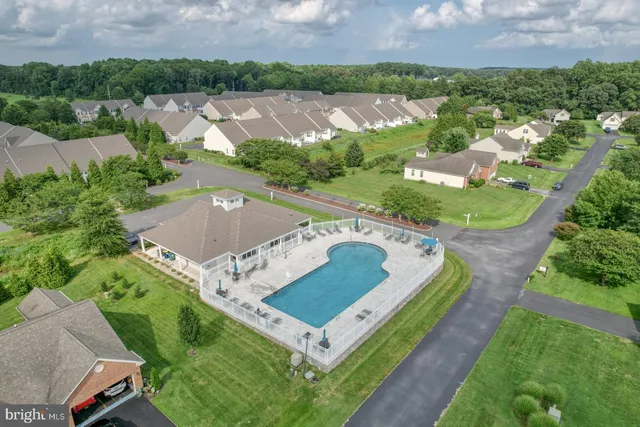 an aerial view of a house with a garden