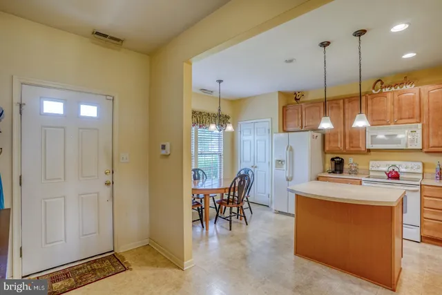 a kitchen that has a lot of cabinets in it