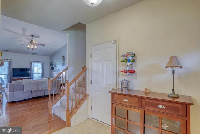 a kitchen with a sink a counter top space stainless steel appliances and cabinets