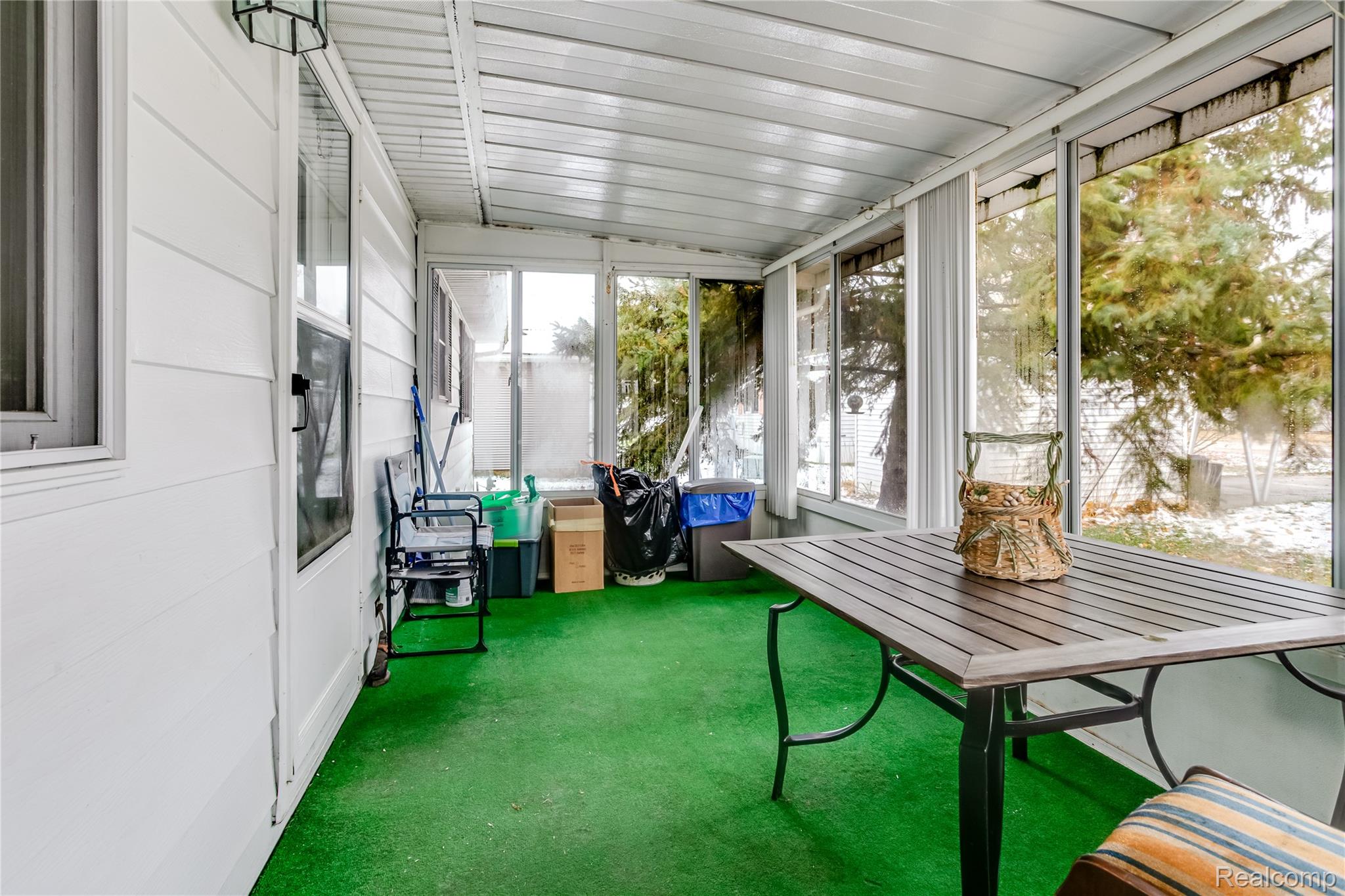 3333 Ravenswood Road Marysville, MI 48040 - Photo 25 of 25 Sunroom with outdoor dining area
