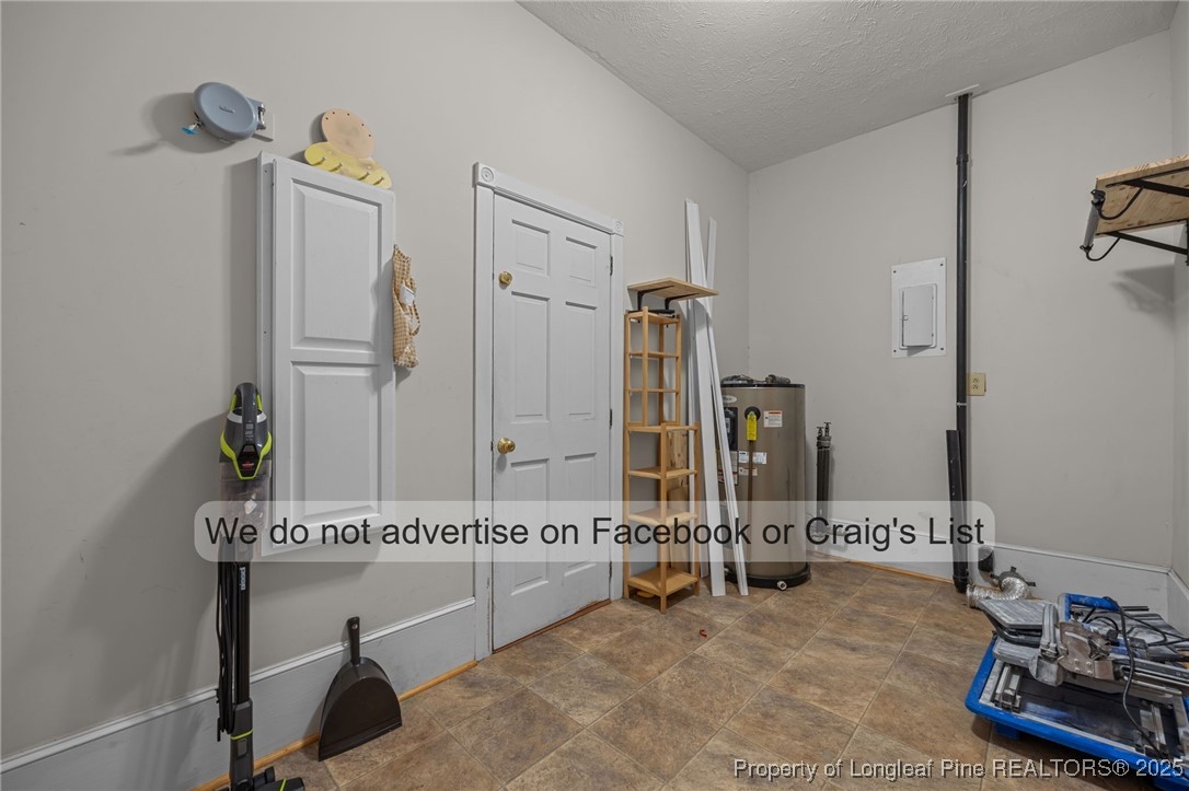 5842 Columbine Road Fayetteville, NC 28306 - Photo 11 of 13 a bathroom with a sink and a mirror