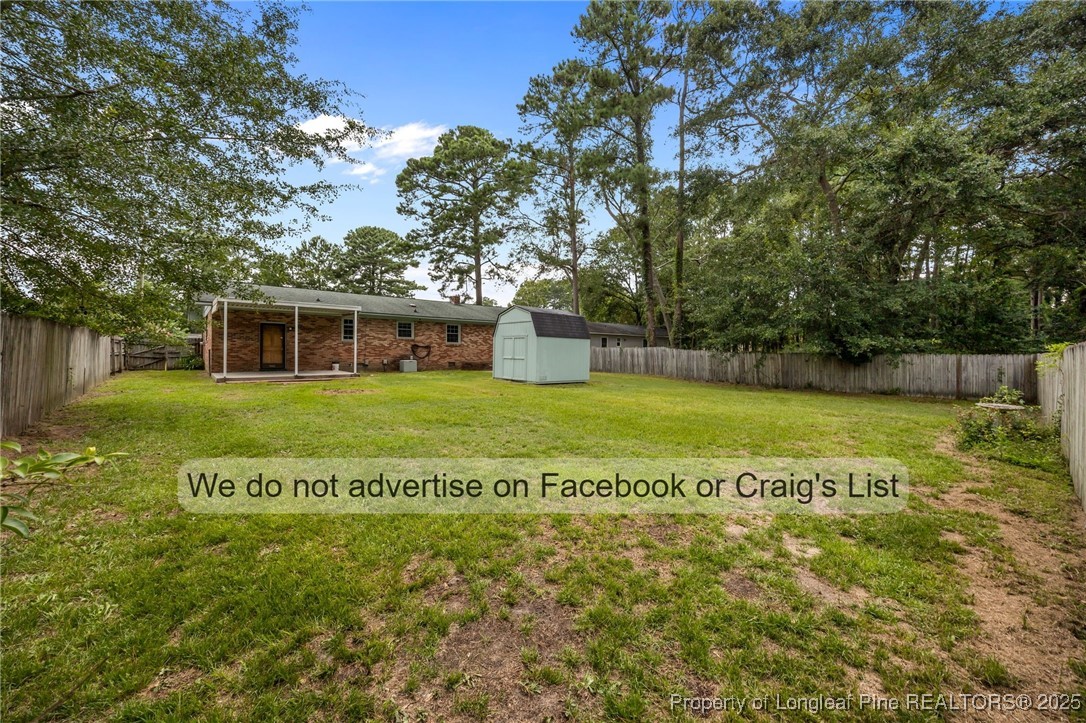 5842 Columbine Road Fayetteville, NC 28306 - Photo 12 of 13 a view of a house with a big yard