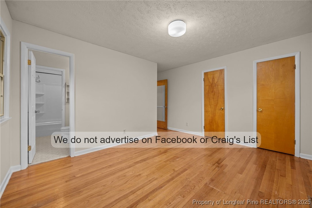 5842 Columbine Road Fayetteville, NC 28306 - Photo 2 of 13 a view of a livingroom with wooden floor and a bathroom