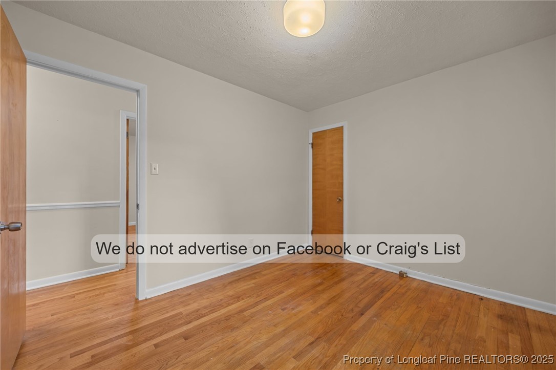 5842 Columbine Road Fayetteville, NC 28306 - Photo 7 of 13 a view of a room with wooden floor