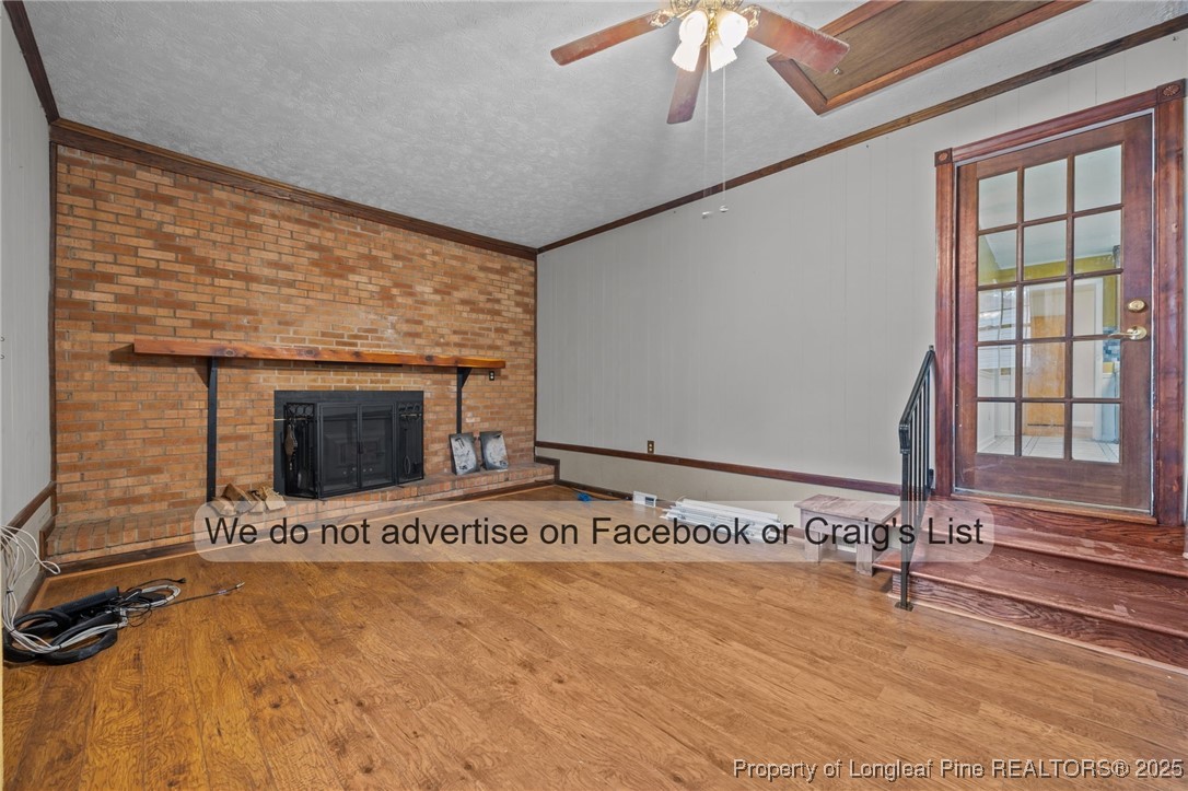5842 Columbine Road Fayetteville, NC 28306 - Photo 10 of 13 a view of an empty room with a fireplace and a window