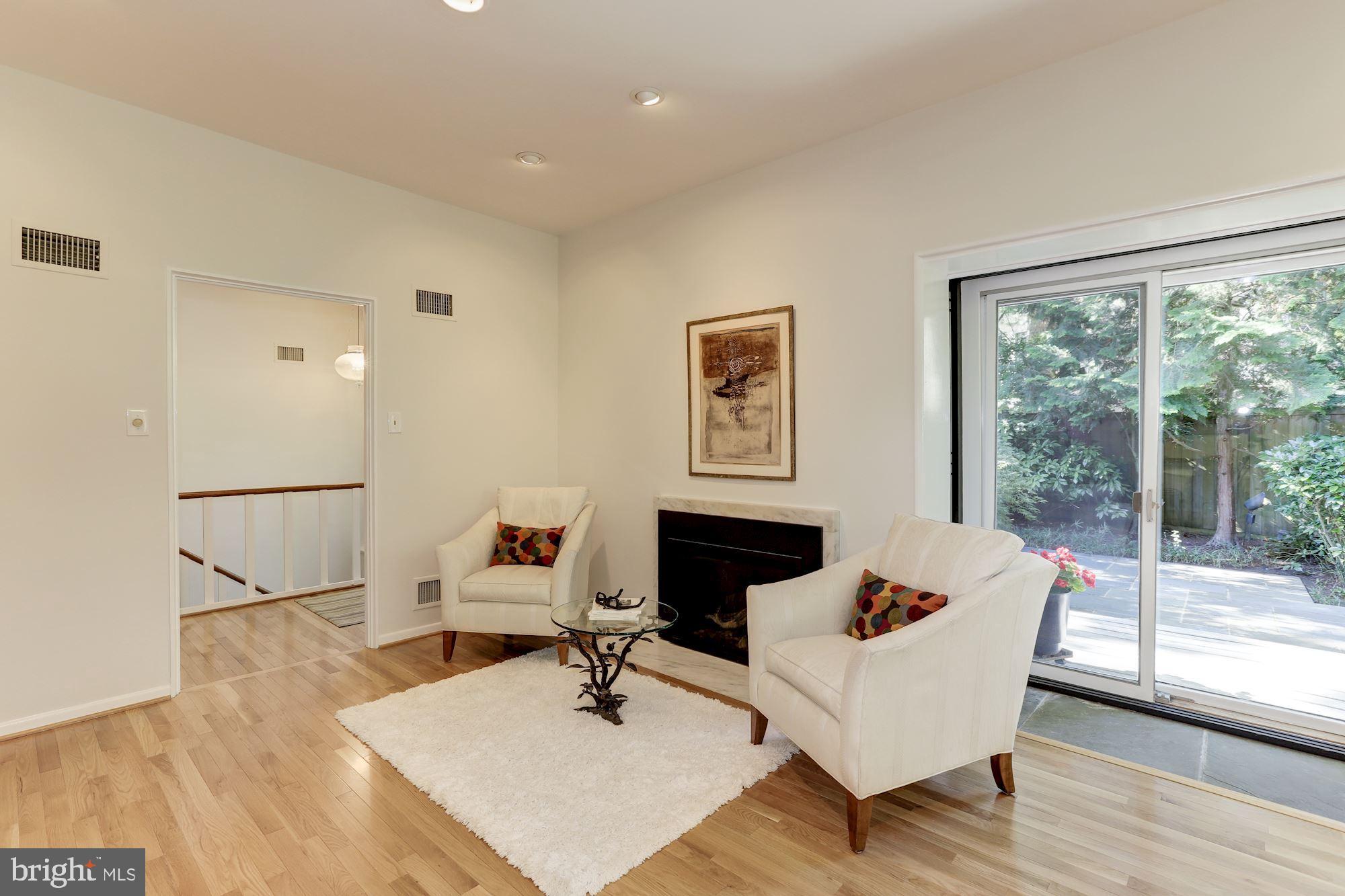 4870 Reservoir Road Northwest Washington, DC 20007 - Photo 14 of 44 Living Room with Marble Surround Gas Fireplace