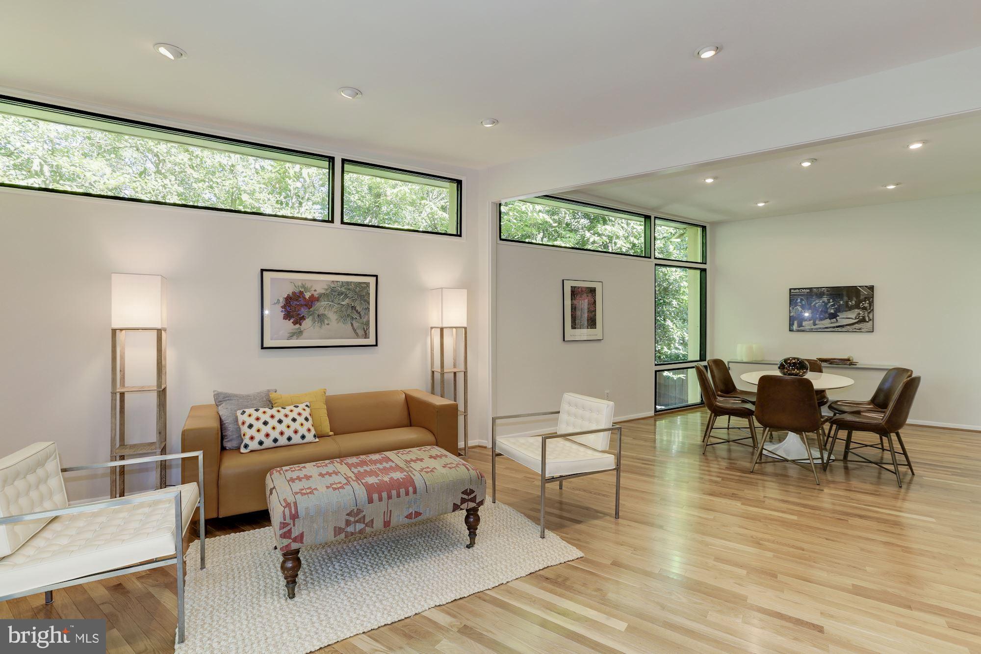4870 Reservoir Road Northwest Washington, DC 20007 - Photo 16 of 44 Living Room/Dining Room with Walls of Windows