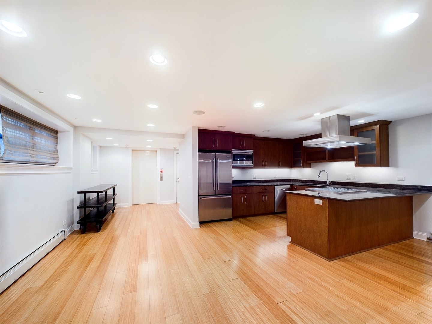 632 West Barry Avenue, Unit GS Chicago, IL 60657 - Photo 6 of 31 a large kitchen with stainless steel appliances granite countertop a large counter top and a stove top oven