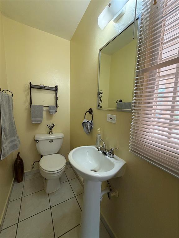 1 St Rio Grande, Unit B6 Rio Grande, PR 00745 - Photo 29 of 47 a bathroom with a sink toilet and mirror
