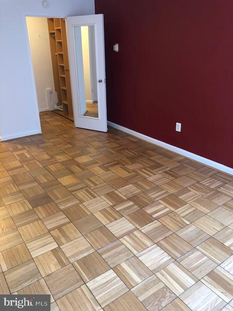 1 Scott Circle Northwest, Unit 814 Washington, DC 20036 - Photo 9 of 15 Spacious room with rich wooden flooring.