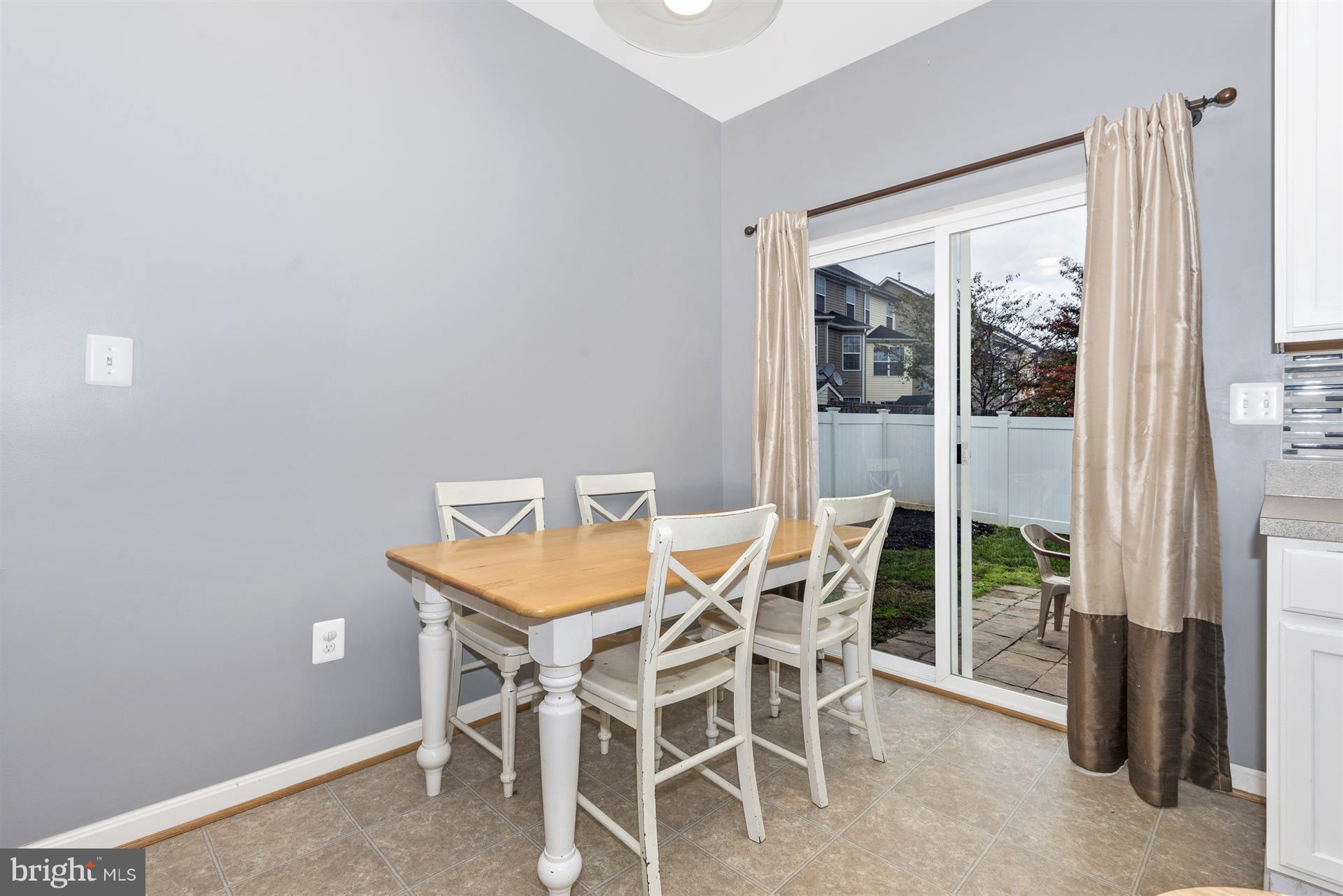 640 Tivoli Road Frederick, MD 21703 - Photo 12 of 29 Kitchen table space w/slider leading to back yard